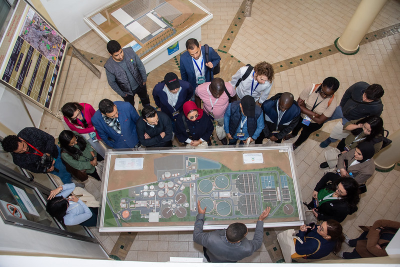 an aerial shot of the marrakech city academy participants viewing a diorama of the city