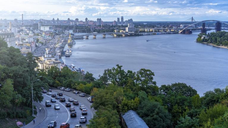 a view of a nature-filled, waterfront city